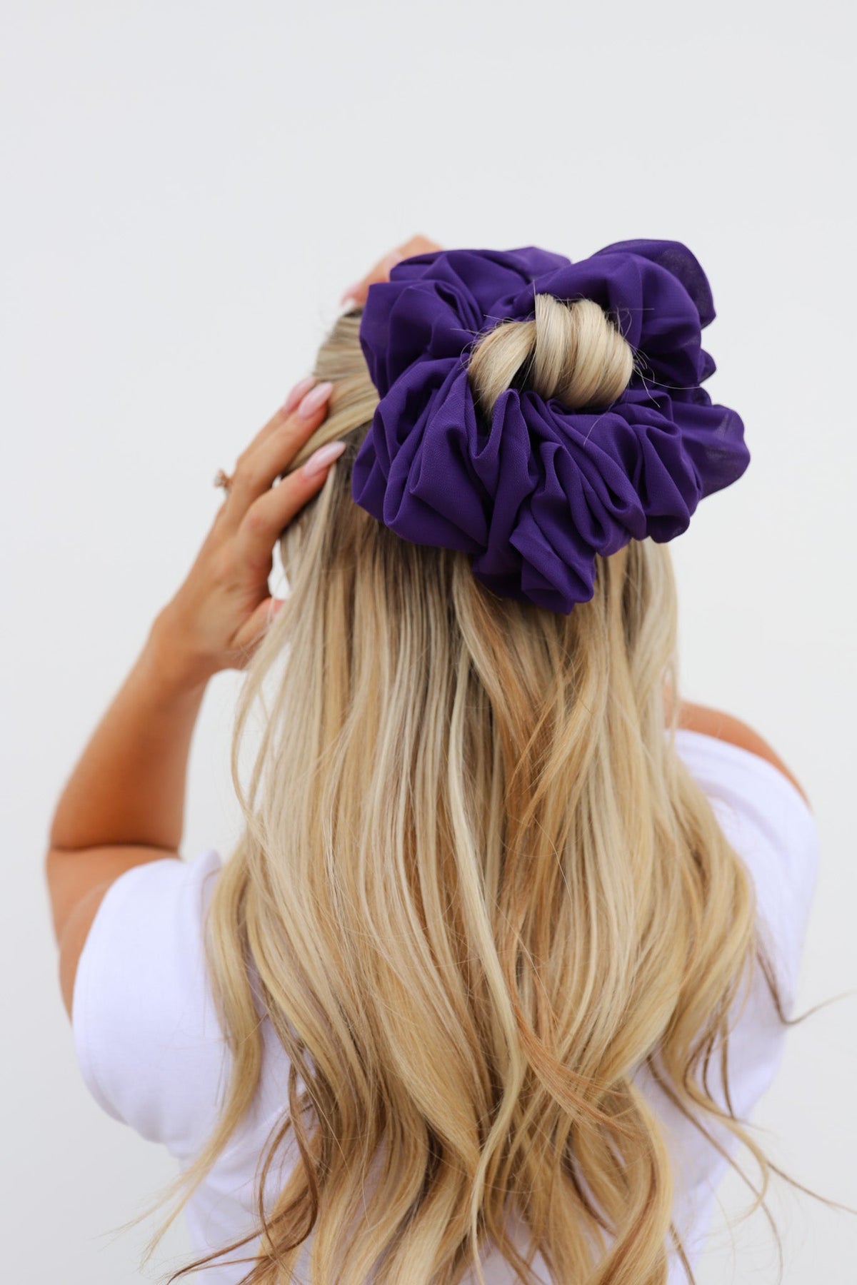 Purple jumbo scrunchie on blonde hair, oversized ruched rosette