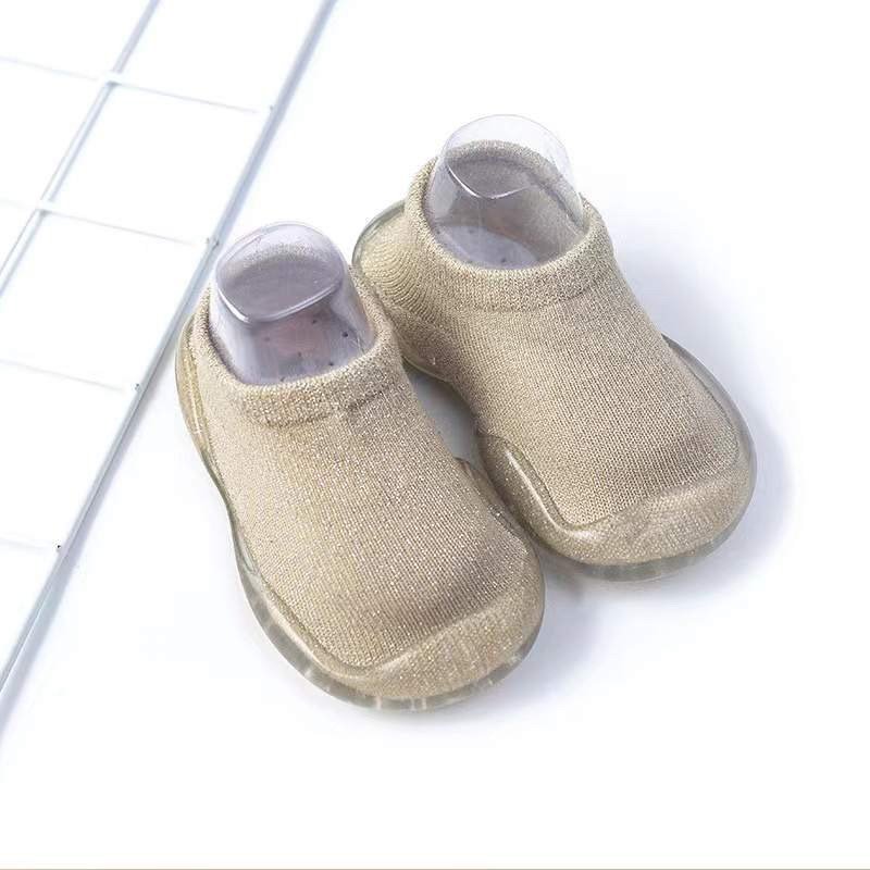 Beige baby sock shoes with clear soles, knit upper, rounded toe