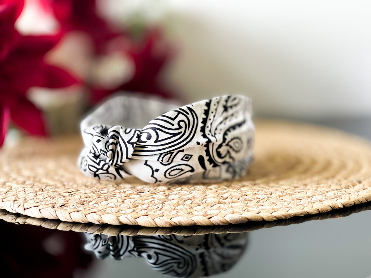 White and black paisley knot headband, side view