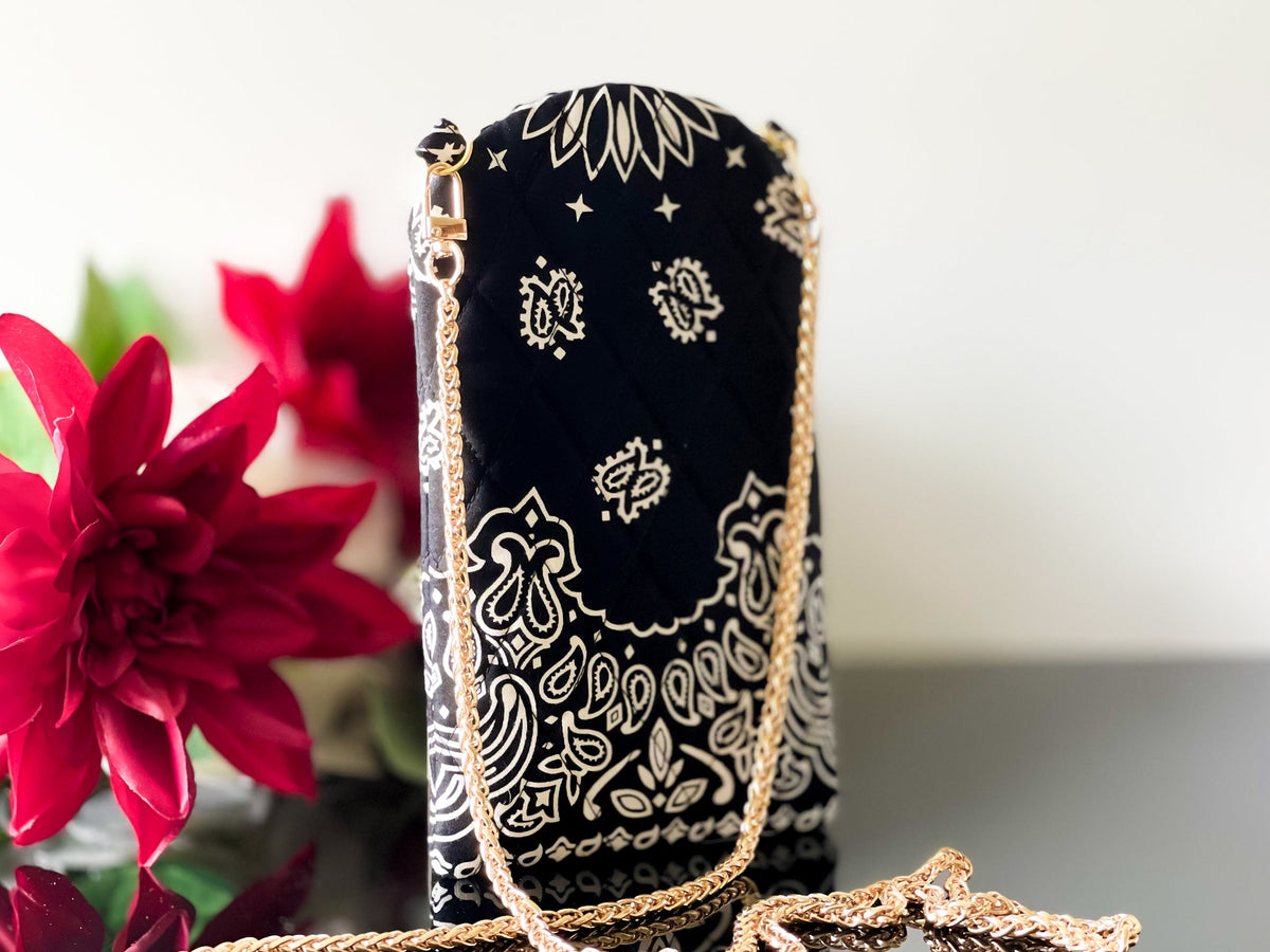 Tall black phone sling pouch with white bandana pattern and gold chain strap