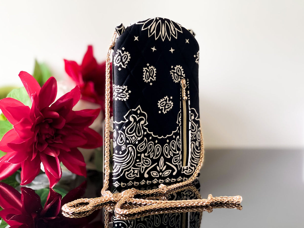 Black bandana-print phone sling pouch with gold chain crossbody strap