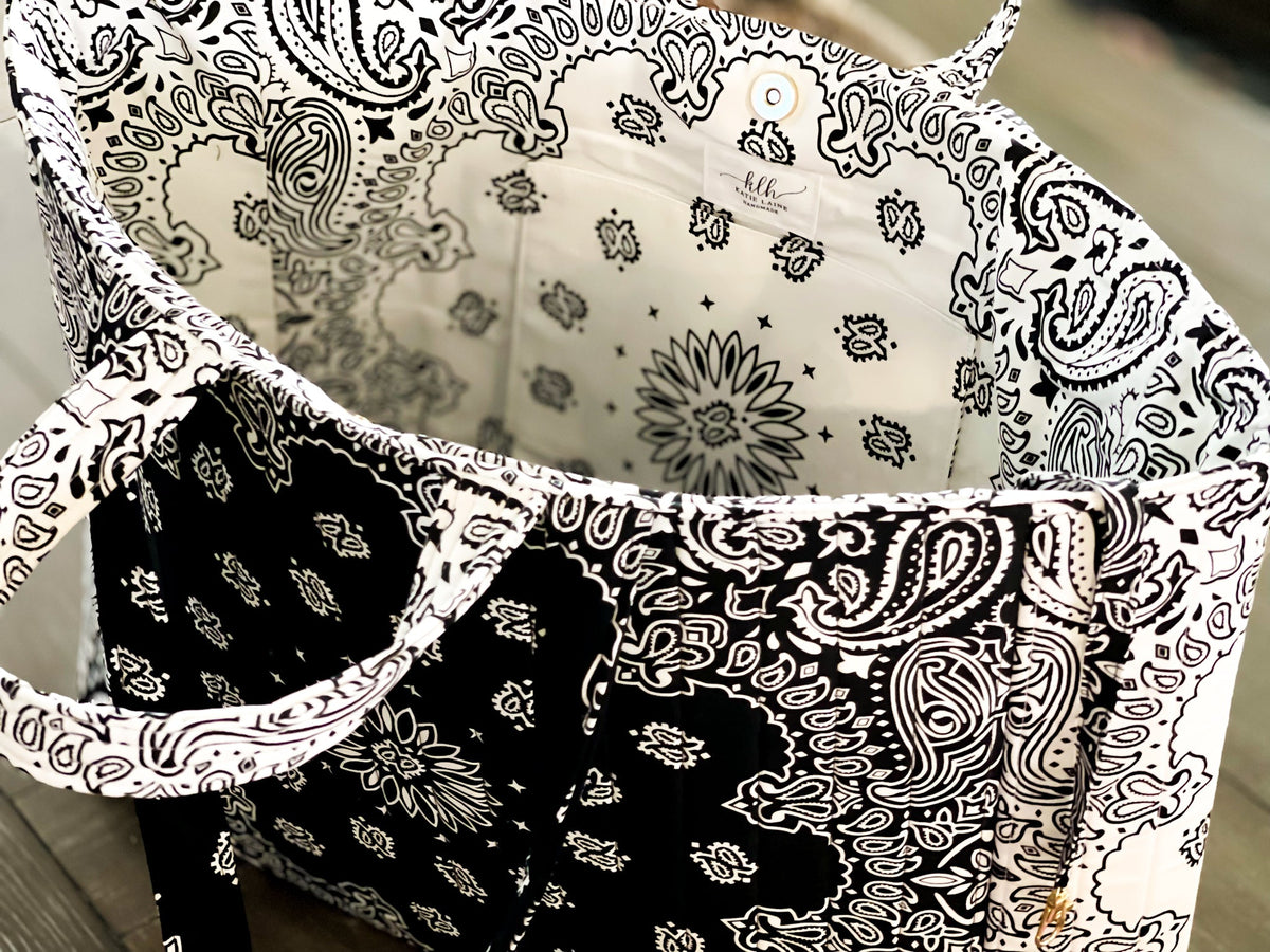 Quilted tote bag interior, open top with black-and-white paisley and lining