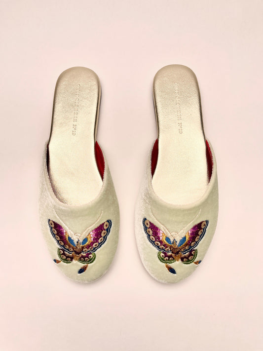 Pair of mint velvet mules with colorful butterfly embroidery, red inner lining
