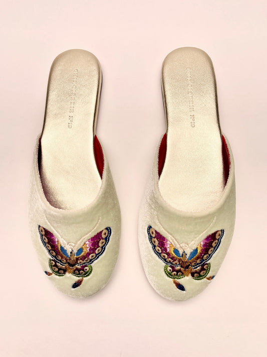 Mint velvet mules with butterfly embroidery on front, red lining, slip-on design