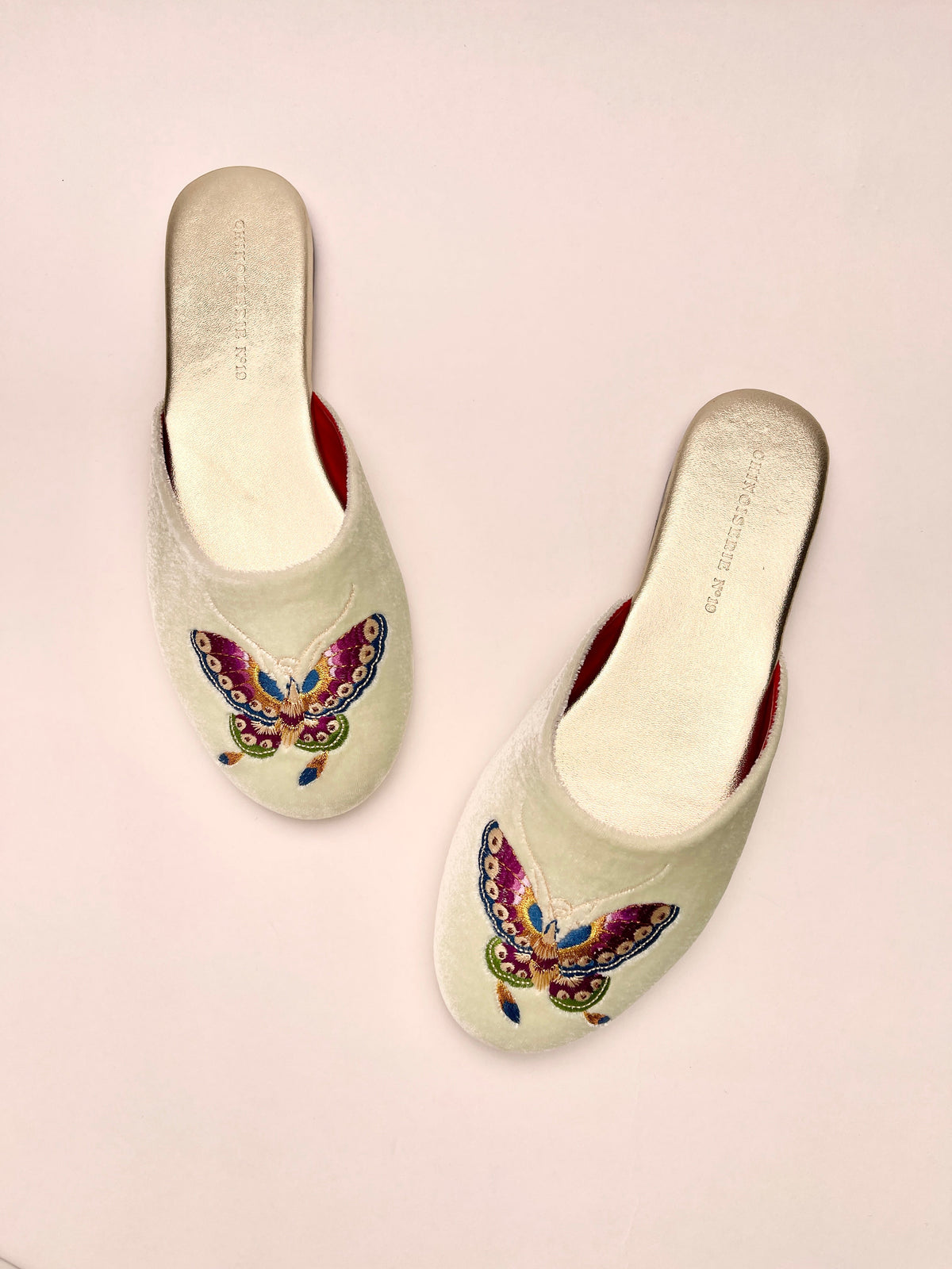 Two mint velvet mules, butterfly embroidery on toes, red side lining