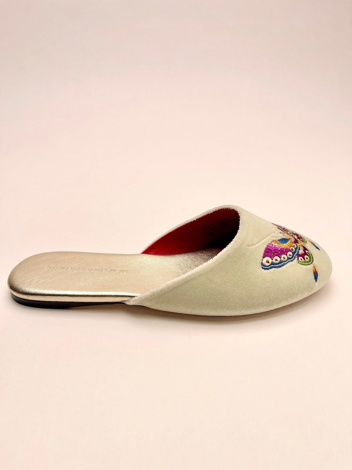 Mint velvet slide mule with butterfly embroidery and red-lined opening