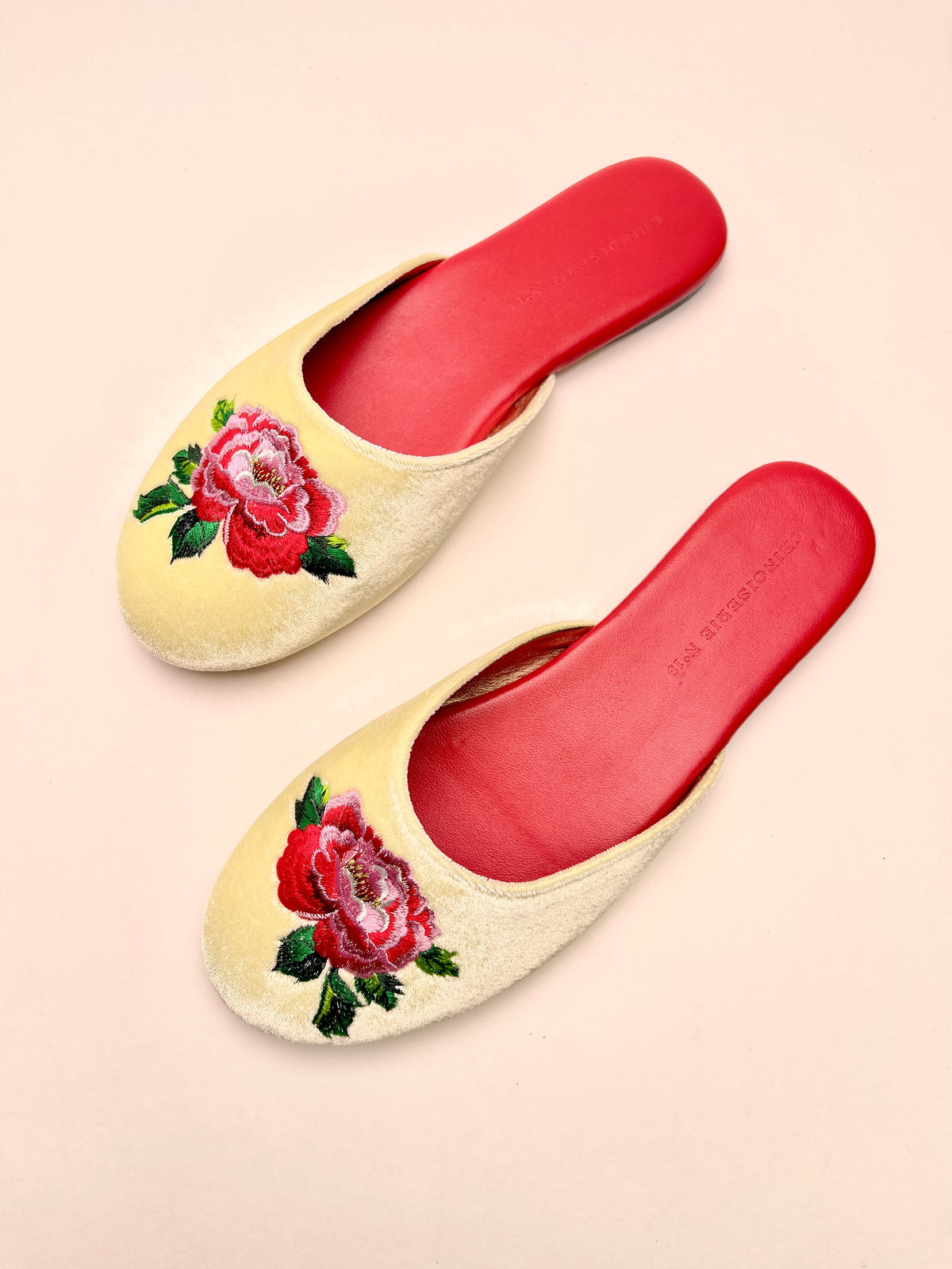 Lemon velvet peony-embroidered mules with red insoles, angled side view, slip-on