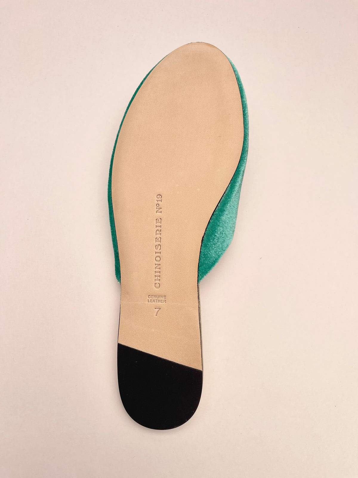 Jade green velvet mule slipper sole view with size marking on beige insole.