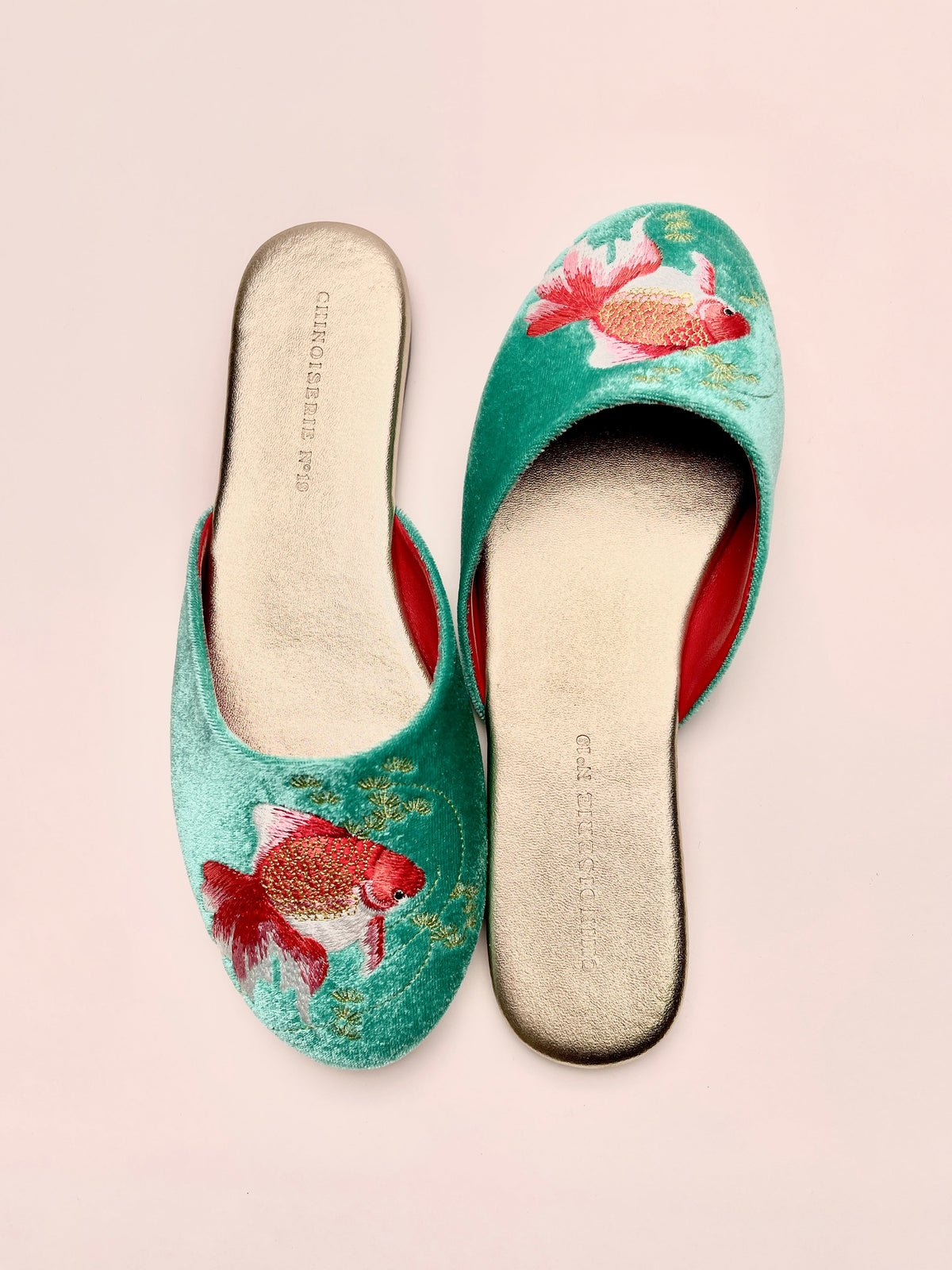 Jade velvet mules, top view of goldfish embroidery and red contrast lining