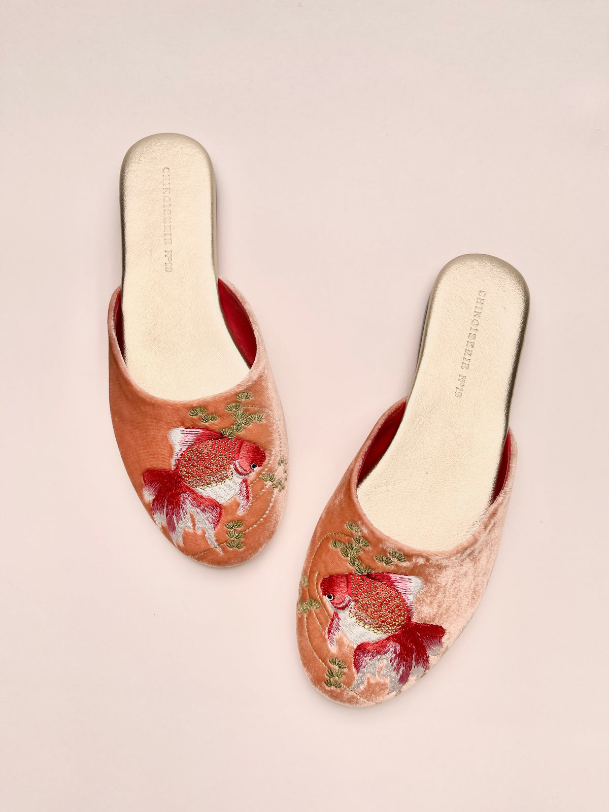 Peach velvet mules with goldfish embroidery, cream lining, slip-on back, pair view