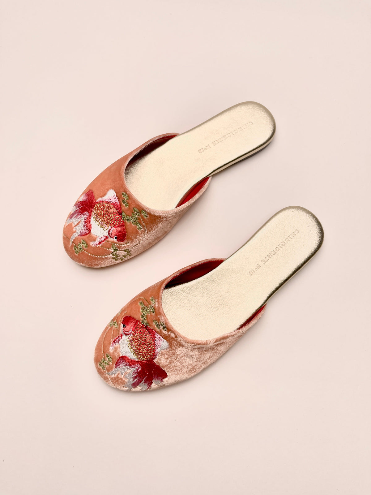Peach velvet embroidered mules with goldfish motifs, two-shoe side view, slip-on