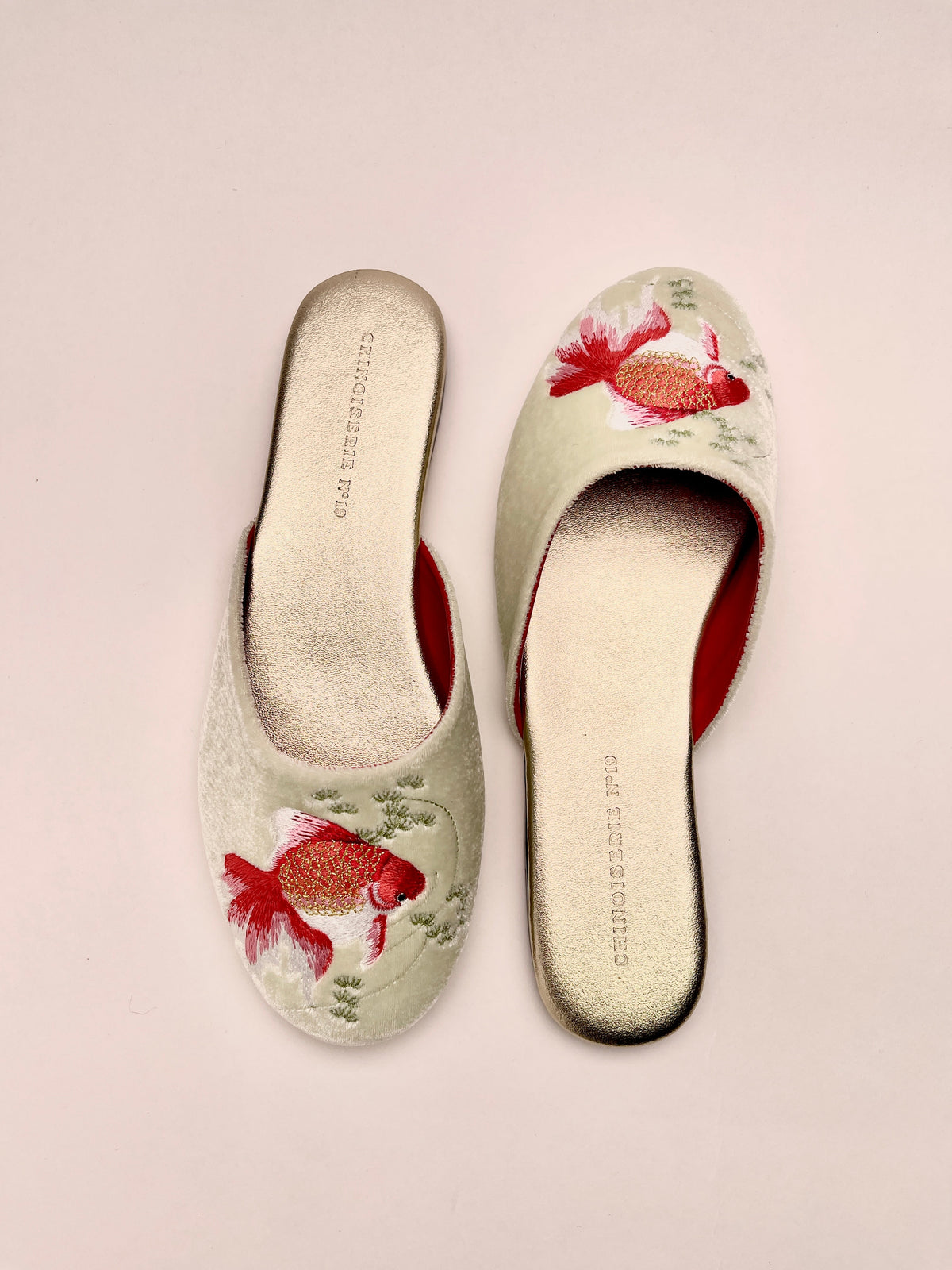 Mint velvet mule slippers with goldfish embroidery and contrasting red inner lining