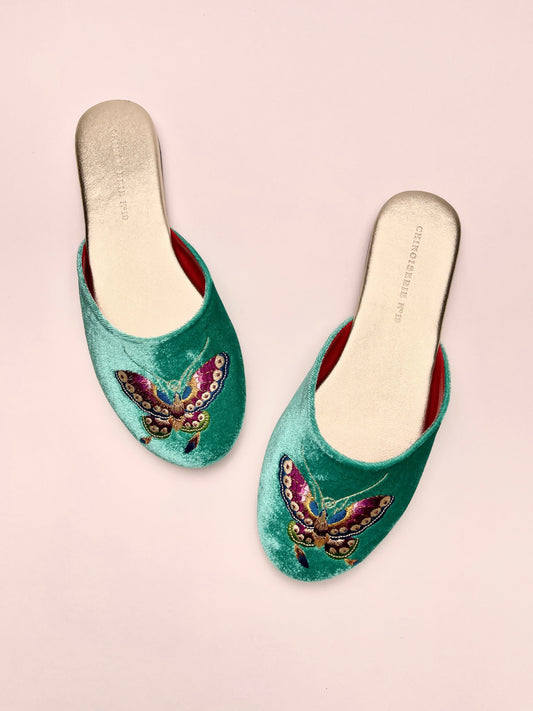 Jade green velvet mule slippers with butterfly embroidery, slip-on, red lining (two angles).