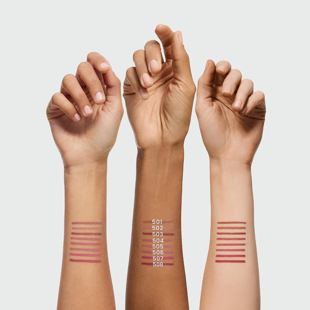 Creamy soft lip liner swatches on wrists in nude, caramel, and rose tones
