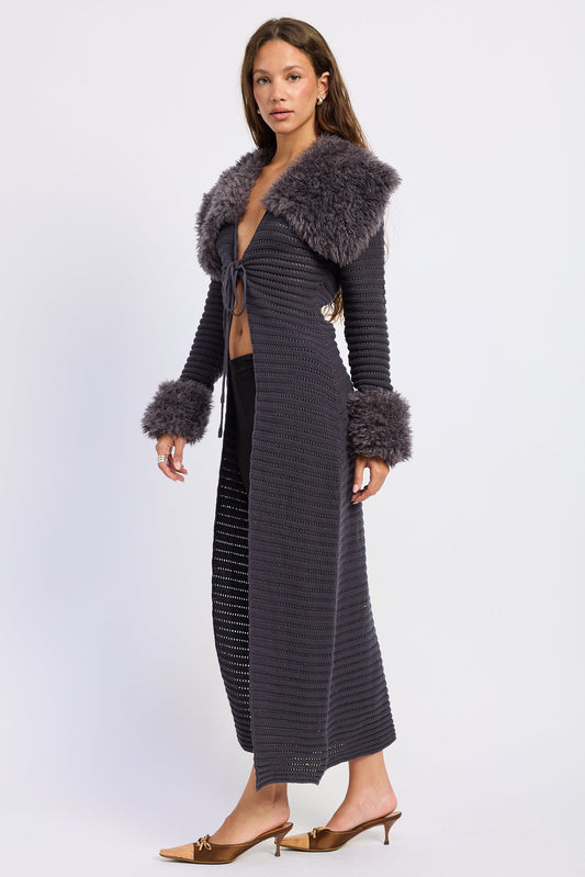 Dark knit maxi cardigan with fuzzy trim at collar, hem, and cuffs