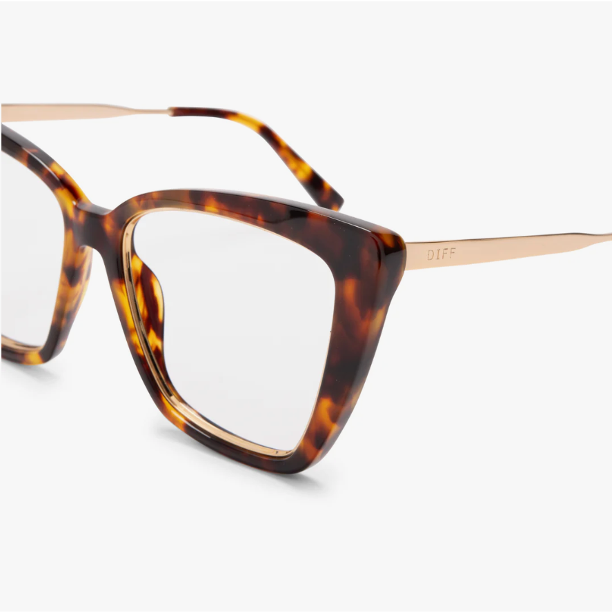 Close-up of amber tortoise glasses frame and gold-tone temple bearing DIFF branding