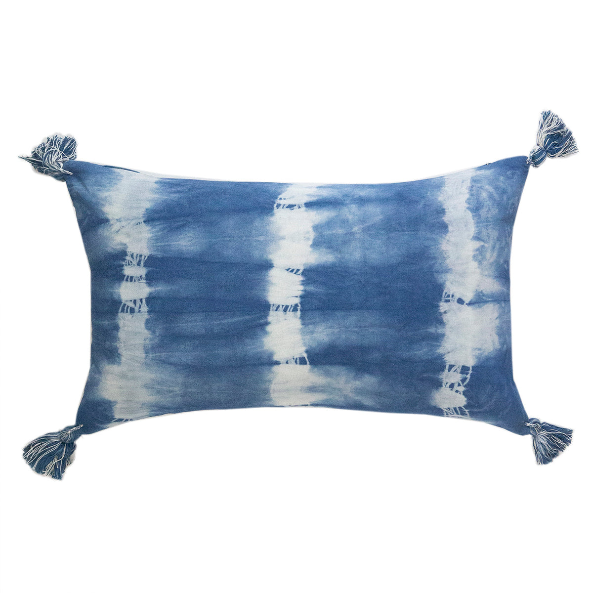 Indigo shibori lumbar pillow with tassels, striped tie-dye pattern