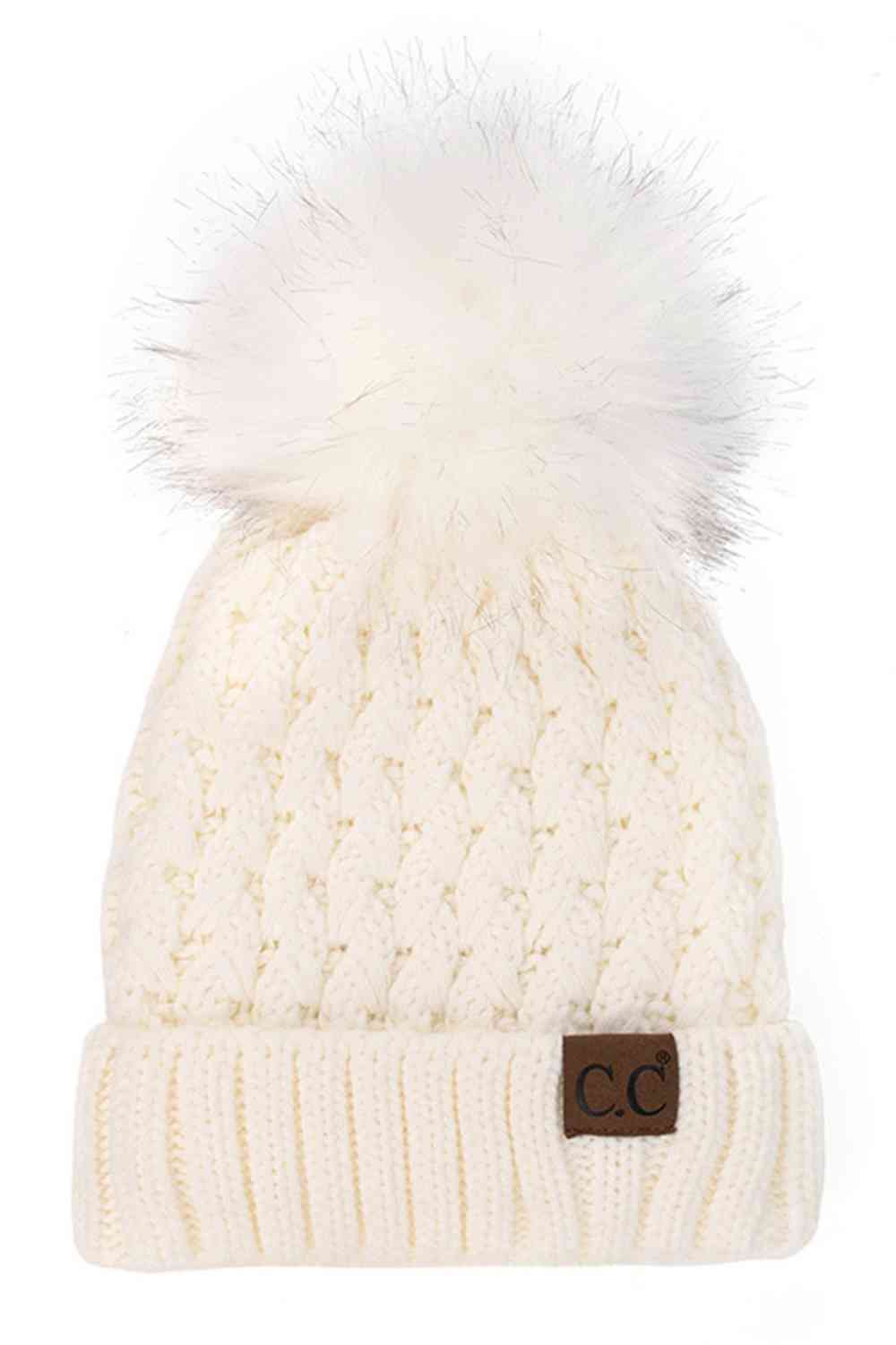 Ivory knitted beanie with fluffy pom-pom and C.C patch on ribbed cuff.