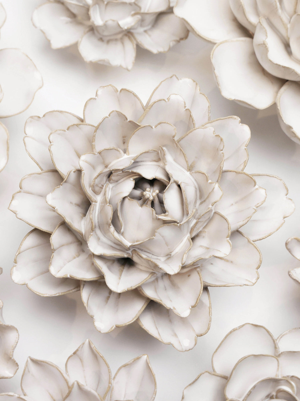 Ivory ceramic peony flower with layered petals and gold accents