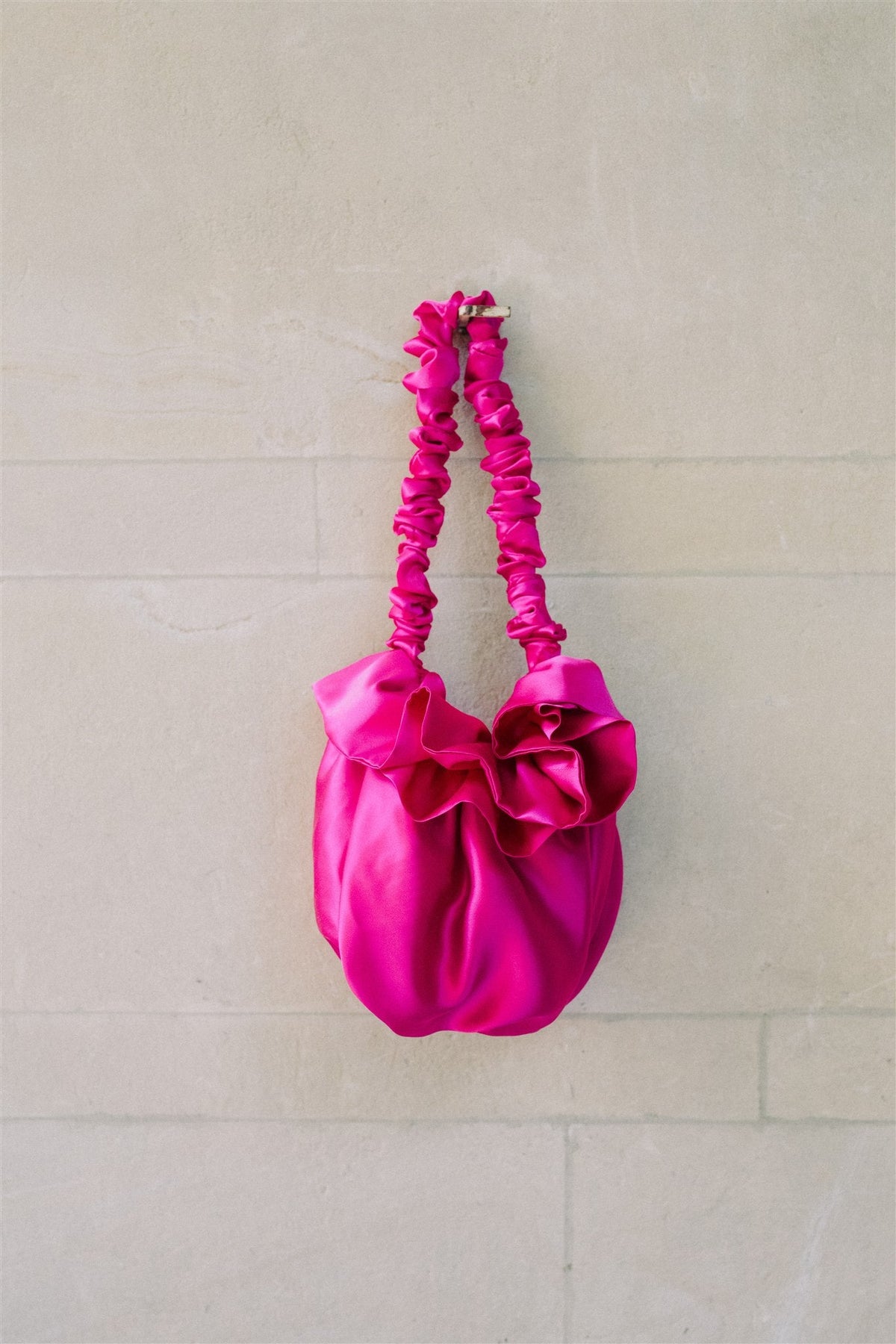 Fuchsia silk Bloom bag with a ruffled top and gathered handle