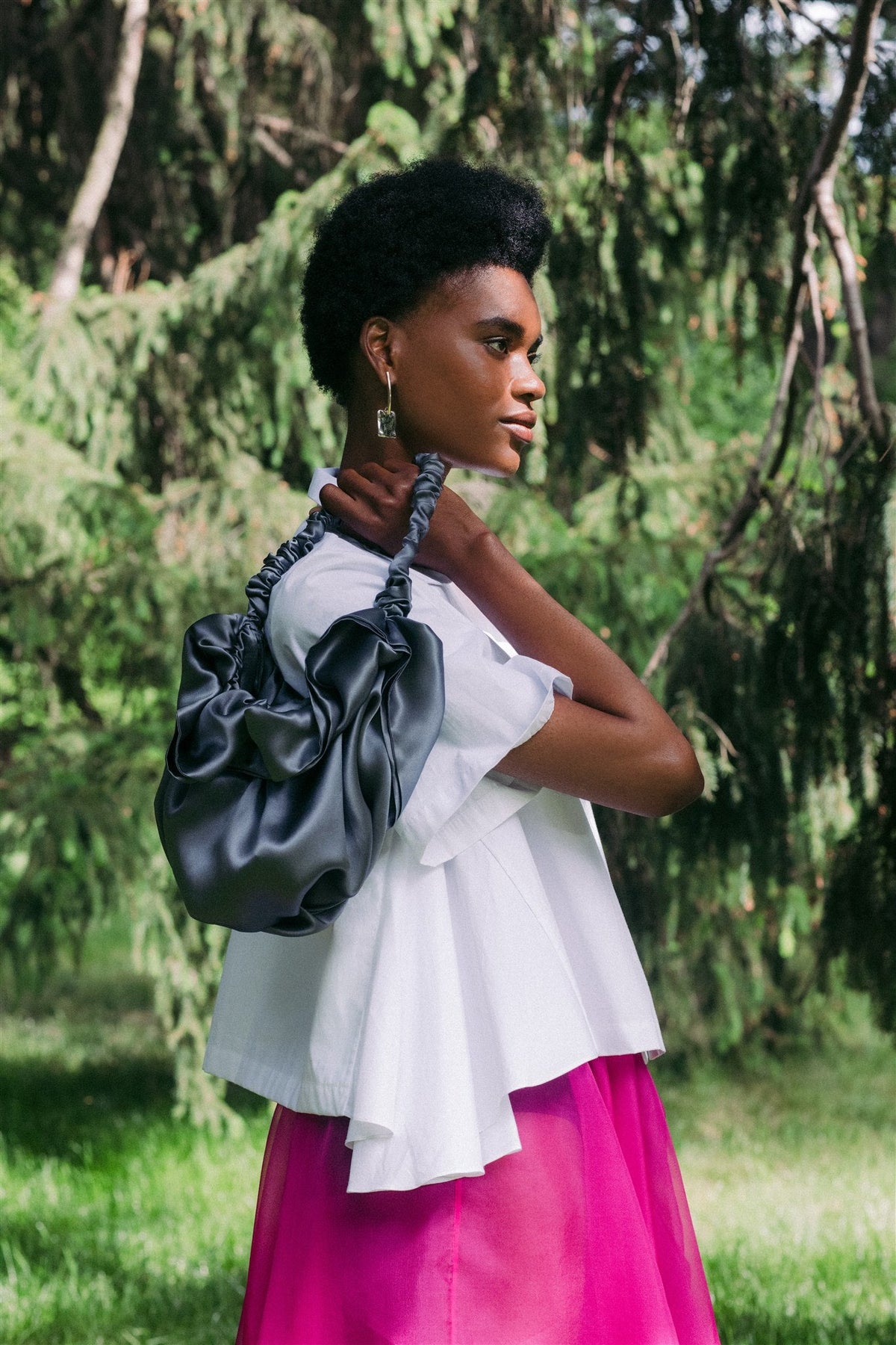 Slate silk Bloom bag worn over the shoulder