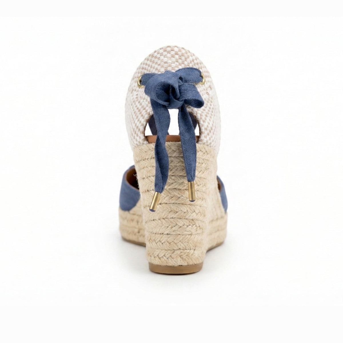 Back view of a blue espadrille wedge with ankle bow and woven heel