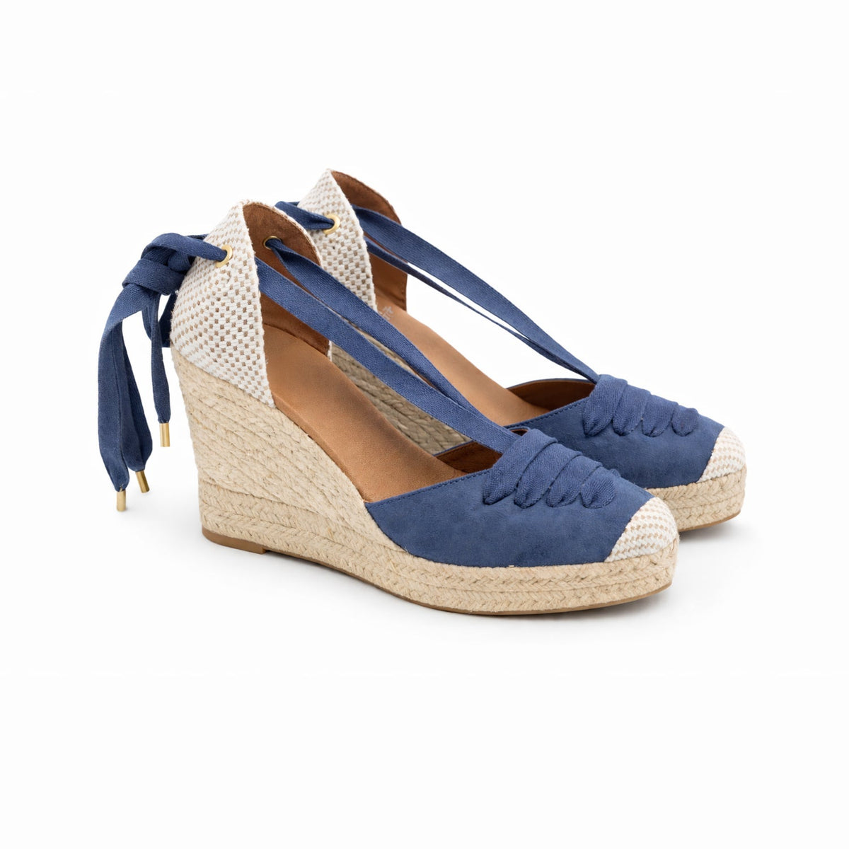 Pair of blue lace-up espadrille wedges with woven soles and toe caps