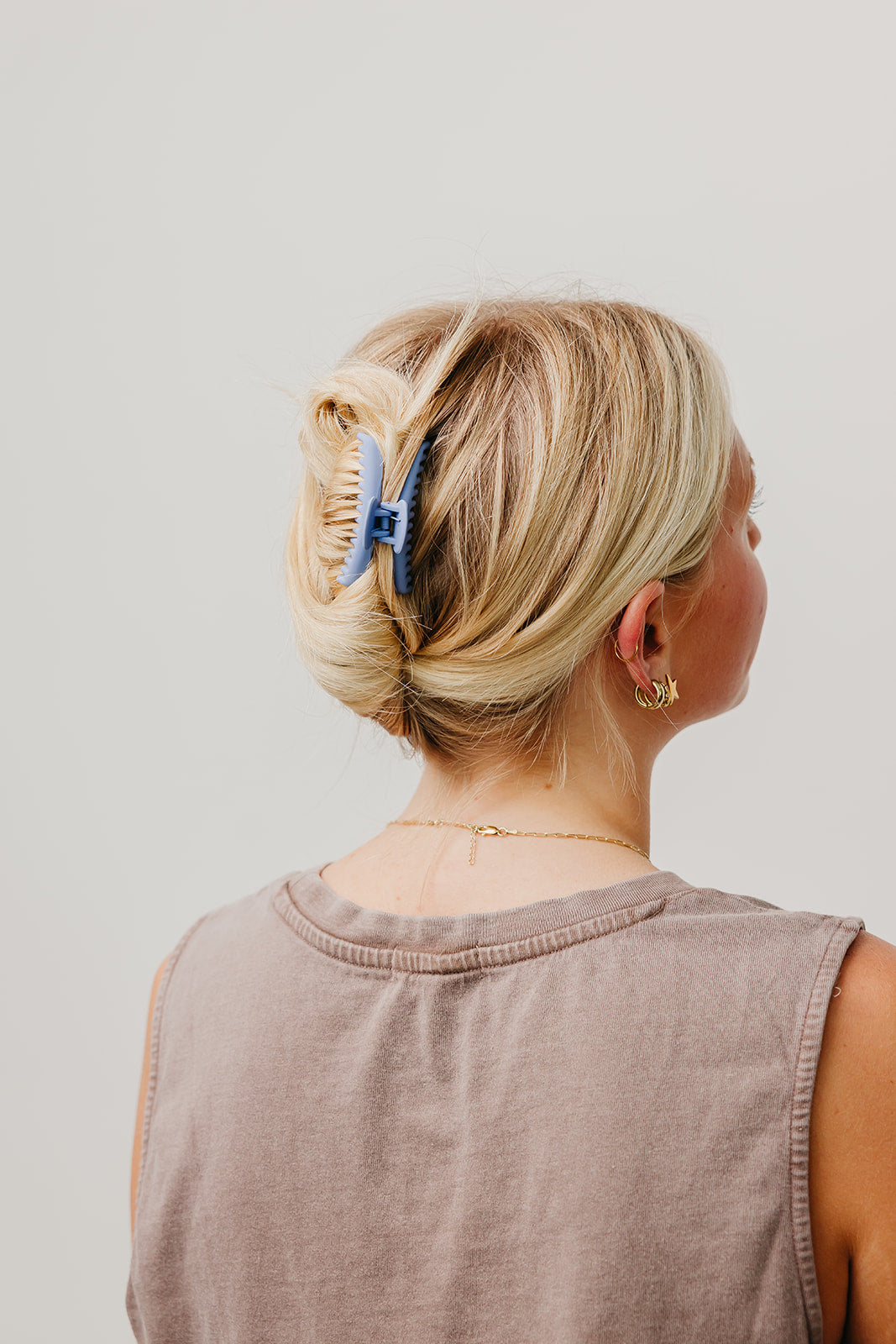 Matte mini hold-everything claw hair clip, blue, securing low bun