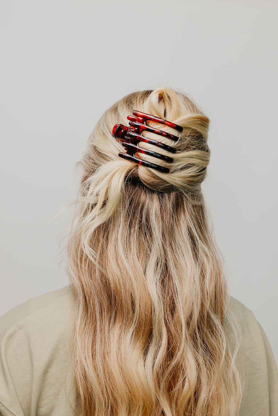 Wide hair claw clip with red-and-dark tortoise pattern