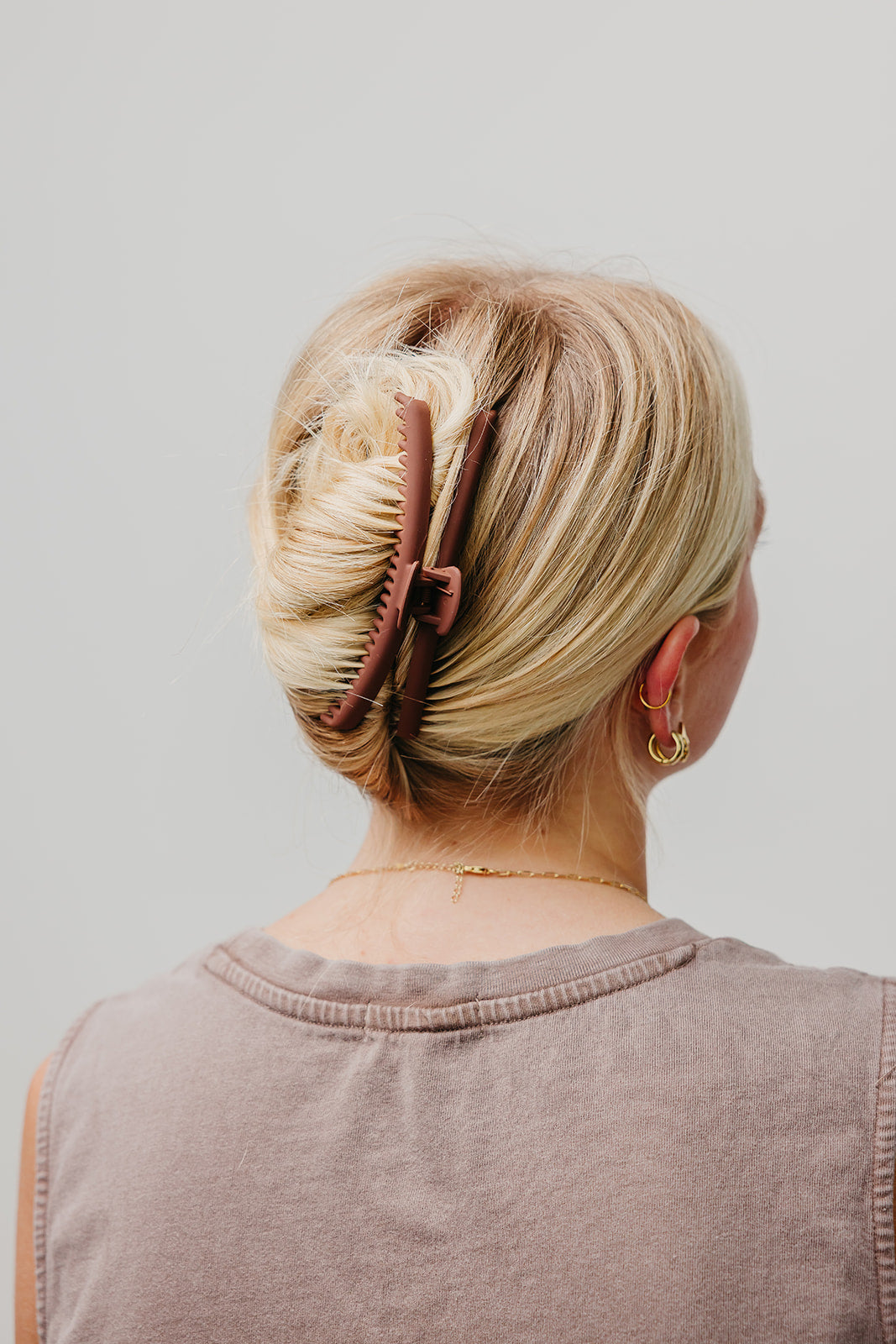Taupe matte claw hair clip in blonde hair, back view