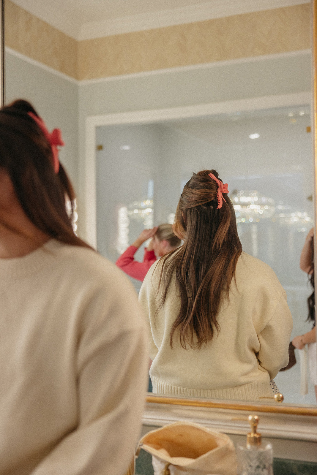 Wavy hold everything claw hair clip partially visible in a bun