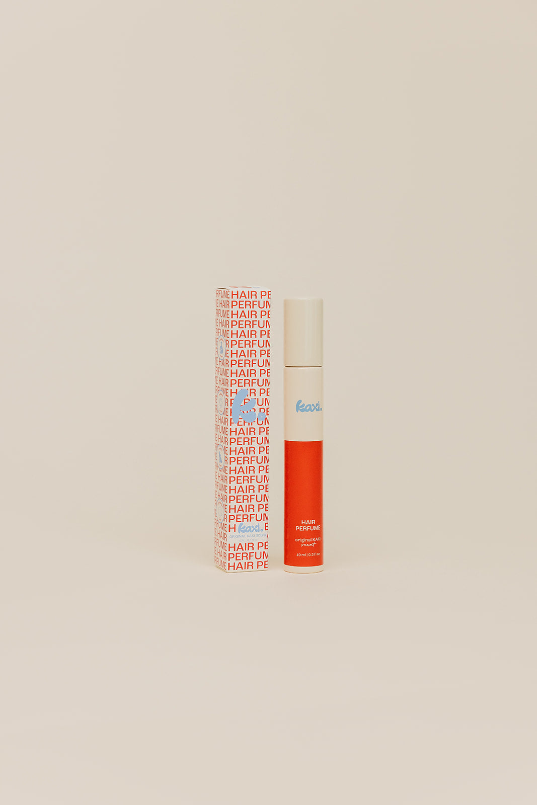 Hair perfume bottle with white cap and orange bottom, shown from the front