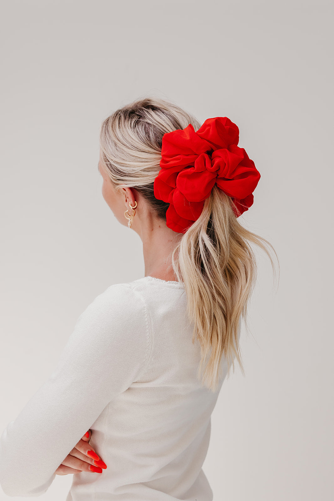 Jumbo scrunchie, bright red ruffled scrunchie on blonde ponytail