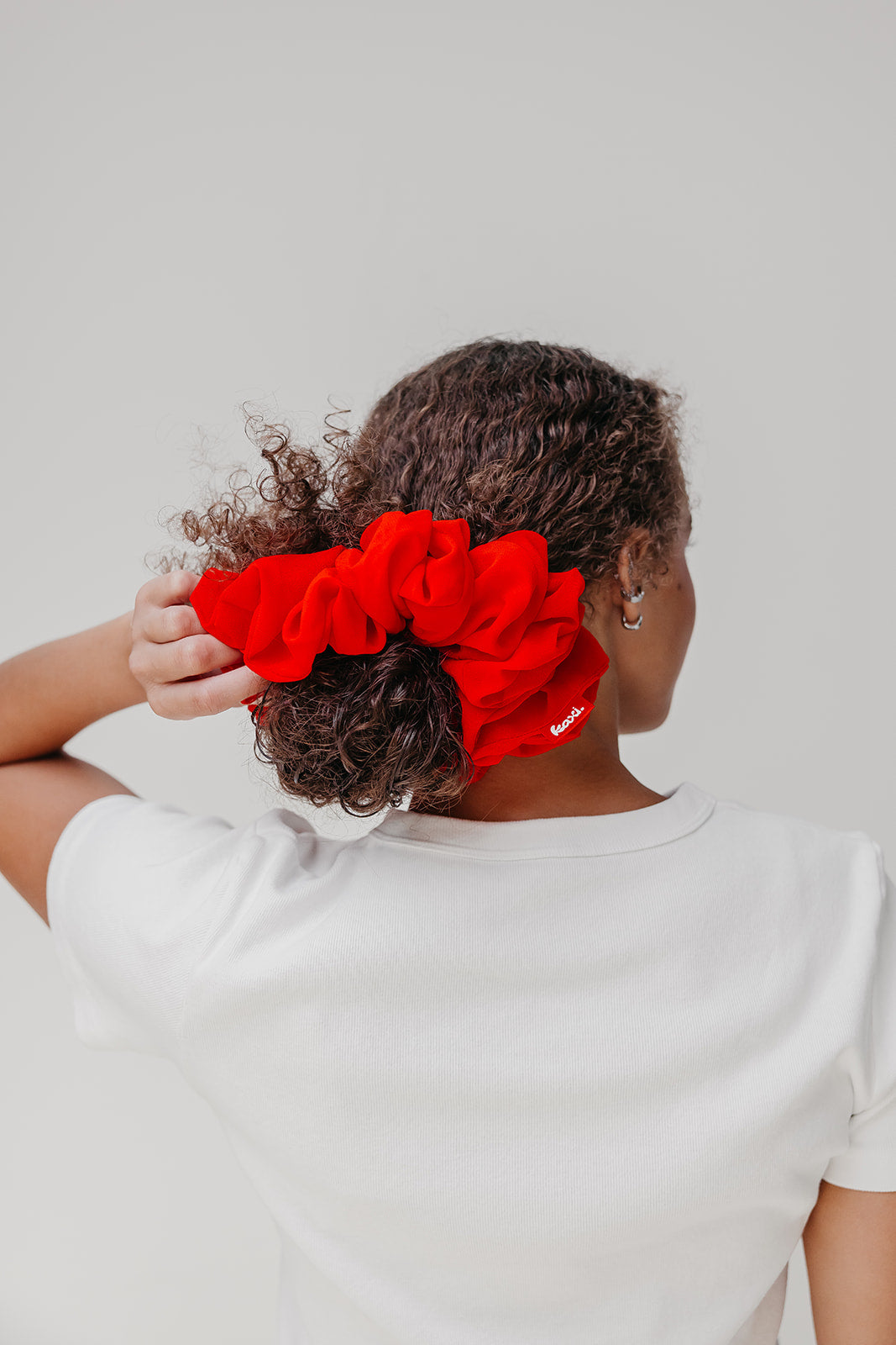 Jumbo scrunchie, vivid red ruffled scrunchie on bun