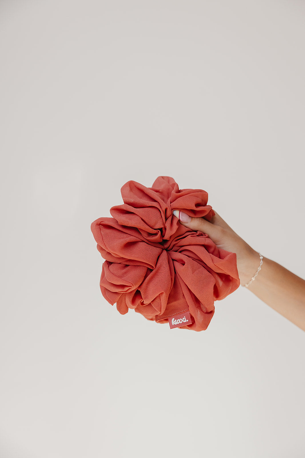Jumbo scrunchie, rust-red scrunched fabric flower design