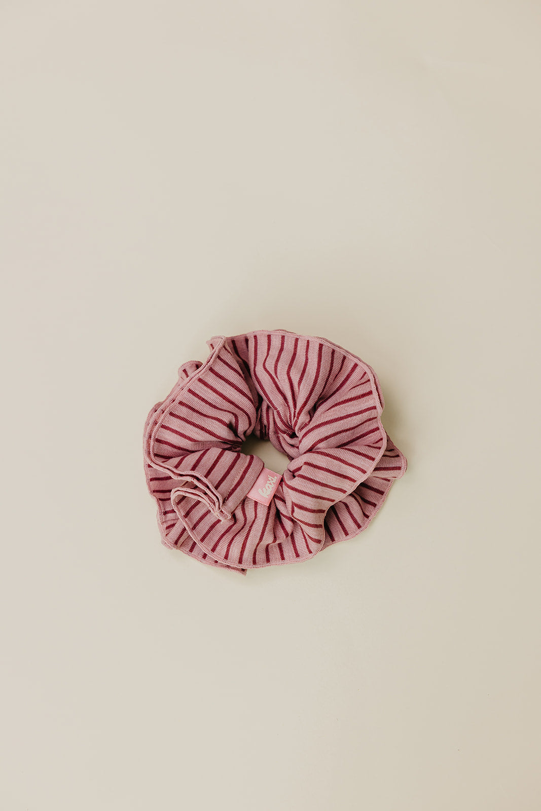 Pink and maroon striped corset-style scrunchie, bunched fabric rosette