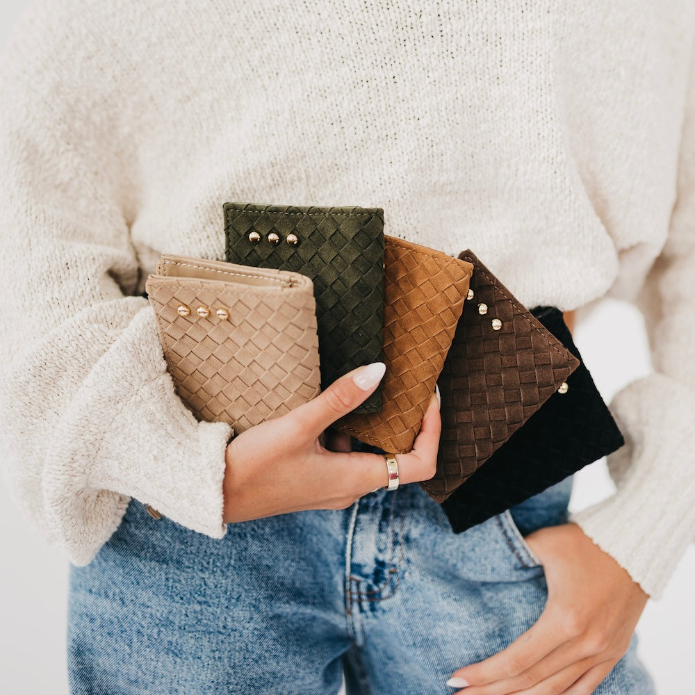Woven suede wallet with snap studs and gold hardware in dark green/olive.