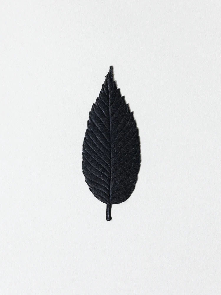 Black leaf-shaped paper incense stick with short stem