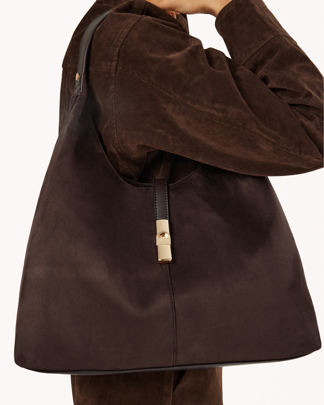 Chocolate slouchy hobo shoulder bag with top handle and gold vertical clasp tab