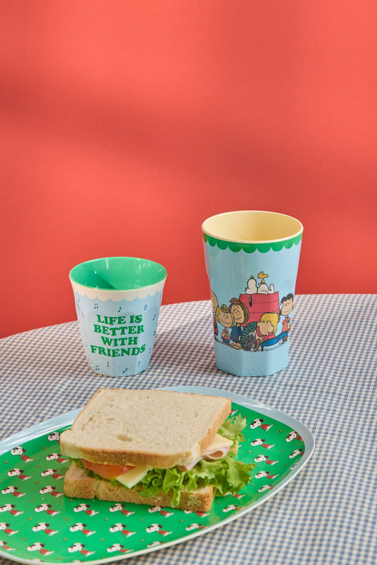 Green Snoopy-print plate with sandwich and two printed cups