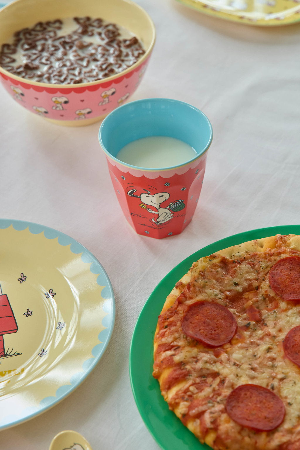 Red Snoopy melamine cup with turquoise interior and character graphic