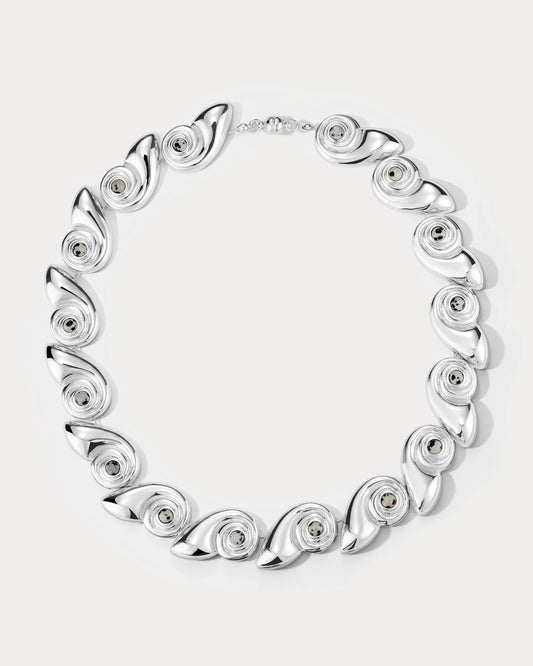 Silver statement necklace with round spiral discs in a linked collar design