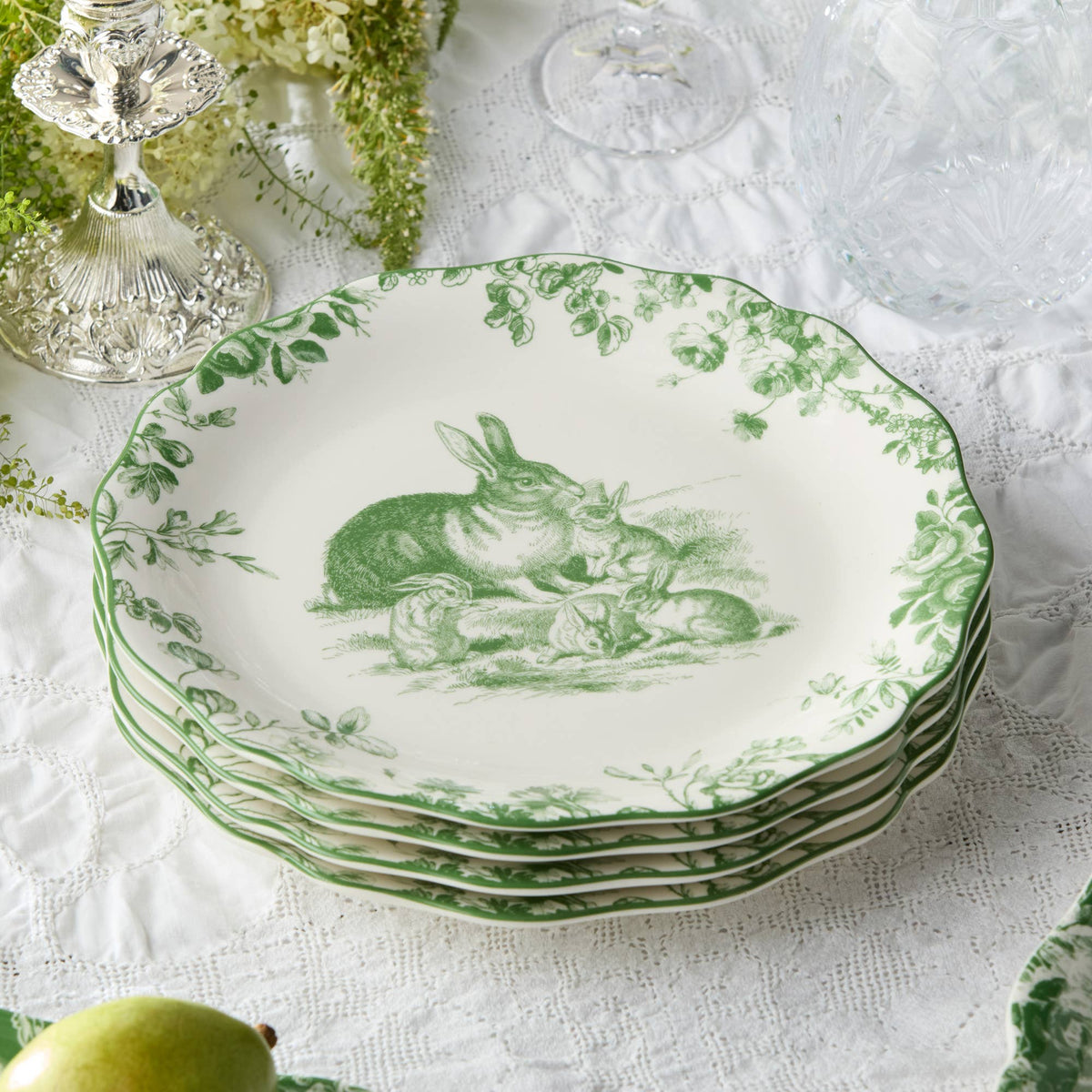 Green-and-white Easter rabbit dinner plate set, stacked with scalloped green rim