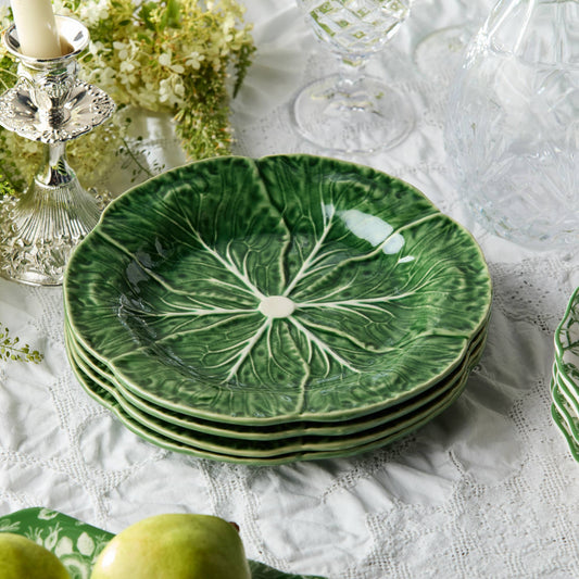 Round green salad plate set of four with white cabbage-leaf design; shown stacked