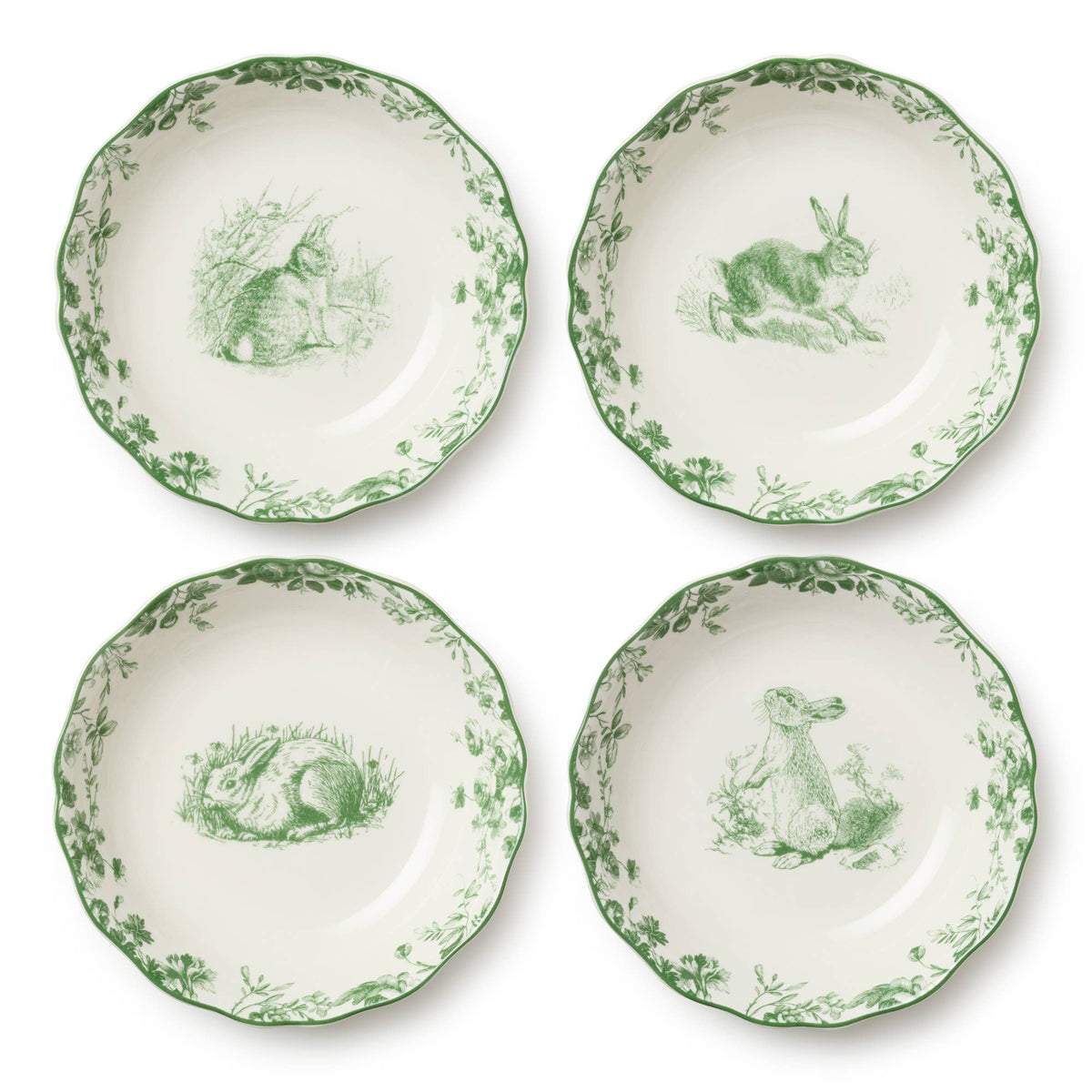 Four green-and-white Easter salad plates with rabbit scene and leaf border