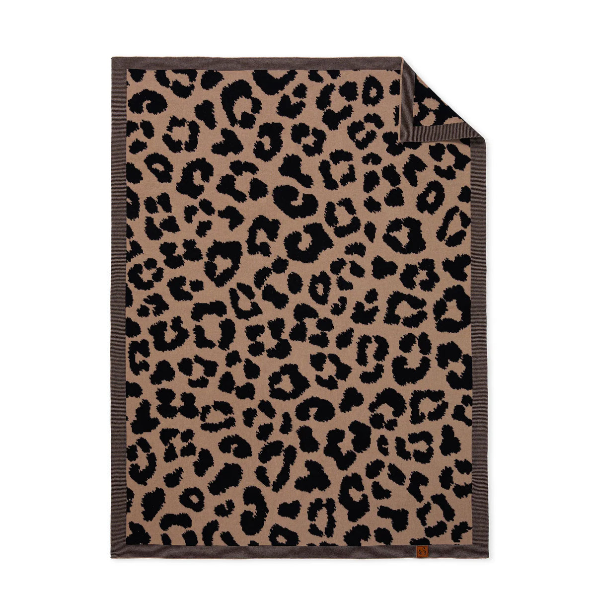 Leopard jacquard knit baby blanket with dark border trim and leopard spots, folded