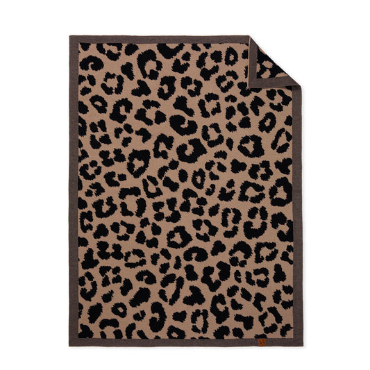 Leopard jacquard knit baby blanket with dark border trim and leopard spots, folded