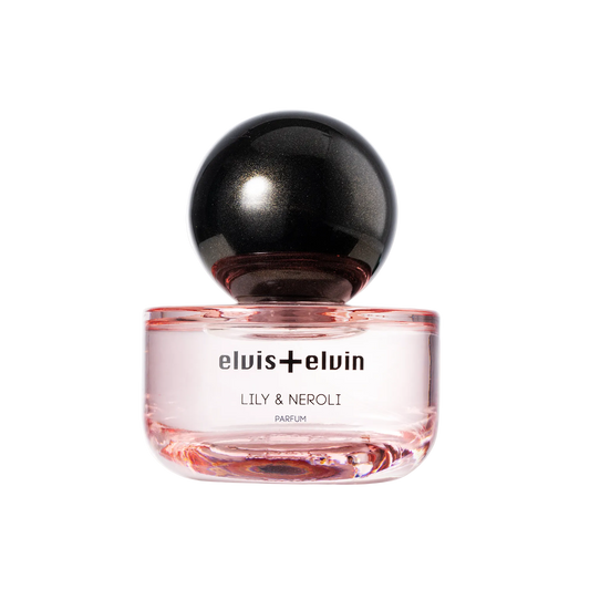 Lily & Neroli perfume bottle with glossy black sphere cap and clear pink glass