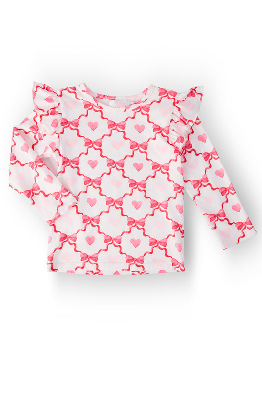 Long-sleeve ruffle tee with pink heart pattern on white, gathered neckline