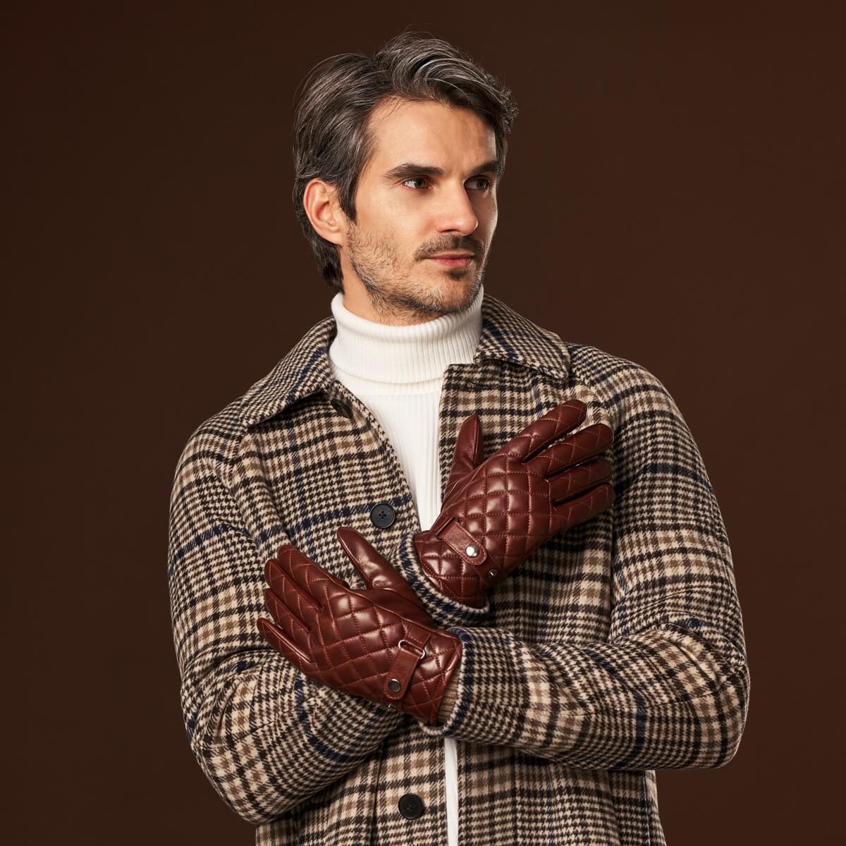 Brown quilted leather gloves with diamond stitching and snap wrist strap